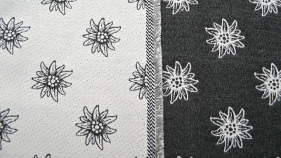 grauer Landhausstil Edelweiß anthrazit Stoff mit Edelweiss  Jacquard Jacquardstoff im Landhaus Hirschstoff Stoff mit Hirschen Landhausstoff mit Edelweiß Hirschen